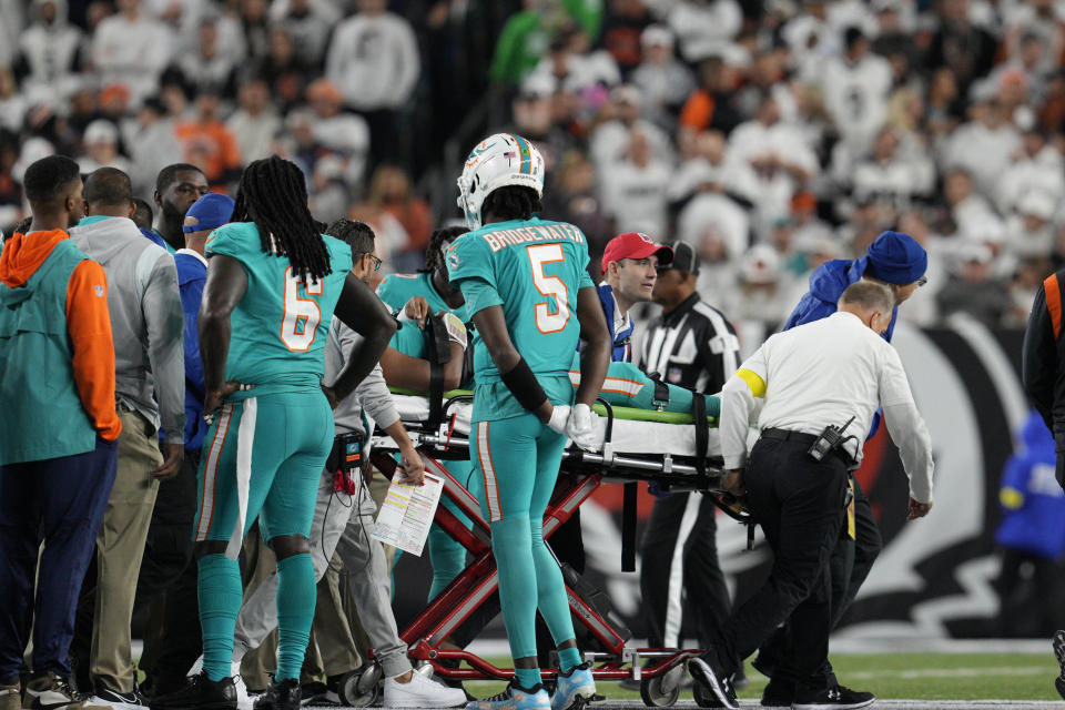 Miami Dolphins quarterback Tua Tagovailoa is taken off the field on a stretcher during the first half of an NFL football game against the Cincinnati Bengals, Thursday, Sept. 29, 2022, in Cincinnati. (AP Photo/Jeff Dean)