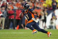 Denver Broncos quarterback Russell Wilson (3) runs against the San Francisco 49ers during the second half of an NFL football game in Denver, Sunday, Sept. 25, 2022. (AP Photo/Jack Dempsey)