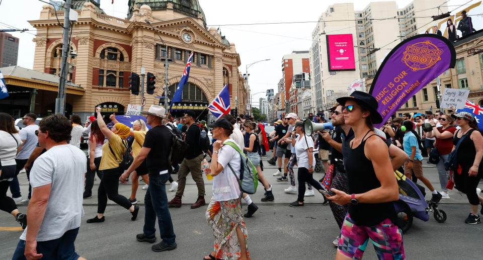 Protesters are seen during a rally against the state government's proposed pandemic laws, in Melbourne, Saturday, November 6, 2021. Source: AAP