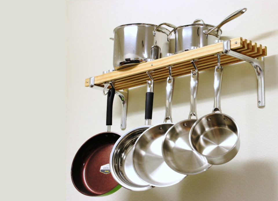 <body> <p>If you're not using your cookware, it shouldn't be eating up space on the counter or stovetop waiting for duty. Get pots and pans out of your way when you install a wall- or ceiling-mounted pot rack. This one, by Cooks Standard, includes a shelf above the rack for spices, books, or even more cookware! <em>Available on <a rel="nofollow noopener" href=" http://www.amazon.com/Cooks-Standard-Wall-Mount-8-Inch/dp/B00DY4S2YA/?_encoding=UTF8&camp=1789&creative=9325&linkCode=ur2&tag=bovi01-20&linkId=4E3XBVJ3CFE4W2HN" target="_blank" data-ylk="slk:Amazon;elm:context_link;itc:0;sec:content-canvas" class="link ">Amazon</a>; $57.</em> </p> <p><strong>Related: <a rel="nofollow noopener" href=" http://www.bobvila.com/slideshow/get-hooked-10-favorite-wall-storage-ideas-12658?bv=yahoo" target="_blank" data-ylk="slk:Get Hooked—10 Favorite Wall Storage Ideas;elm:context_link;itc:0;sec:content-canvas" class="link ">Get Hooked—10 Favorite Wall Storage Ideas</a> </strong> </p> </body>