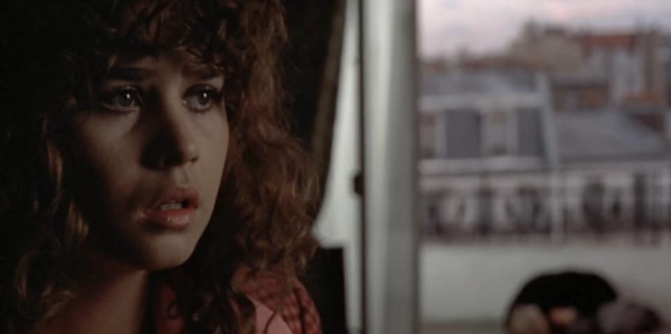 Close-up of Jeanne with Paul's dead body in the background in "Last Tango in Paris"