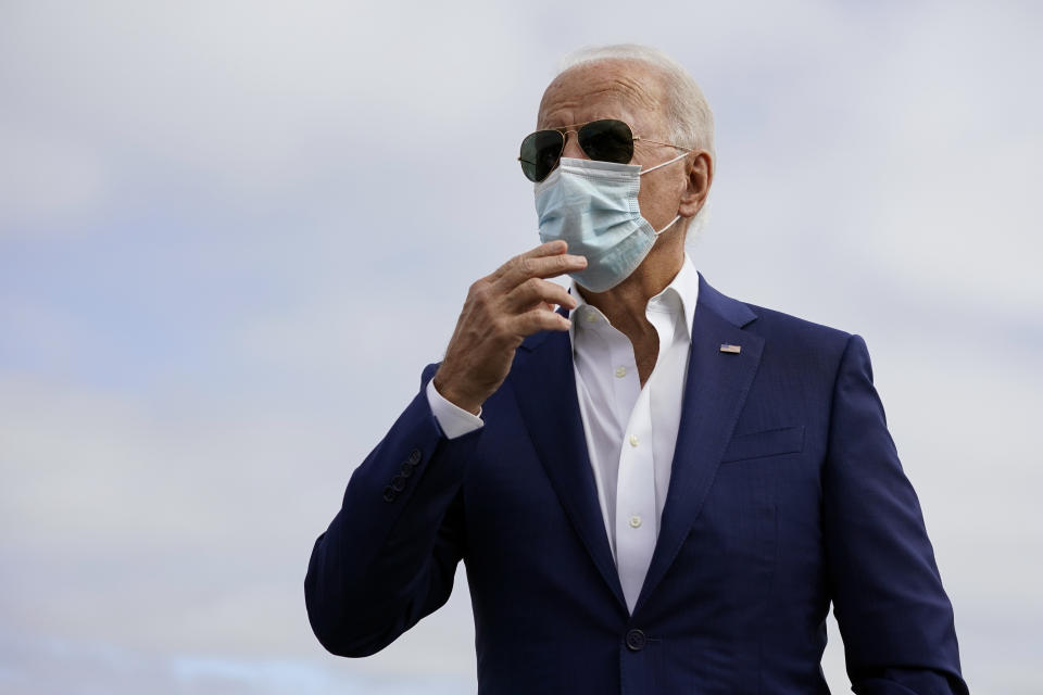 Democratic presidential candidate former Vice President Joe Biden speaks to members of the media before boardin his campaign plane at New Castle Airport, in New Castle, Del., Tuesday Oct. 13, 2020, en route to Florida. (AP Photo/Carolyn Kaster)