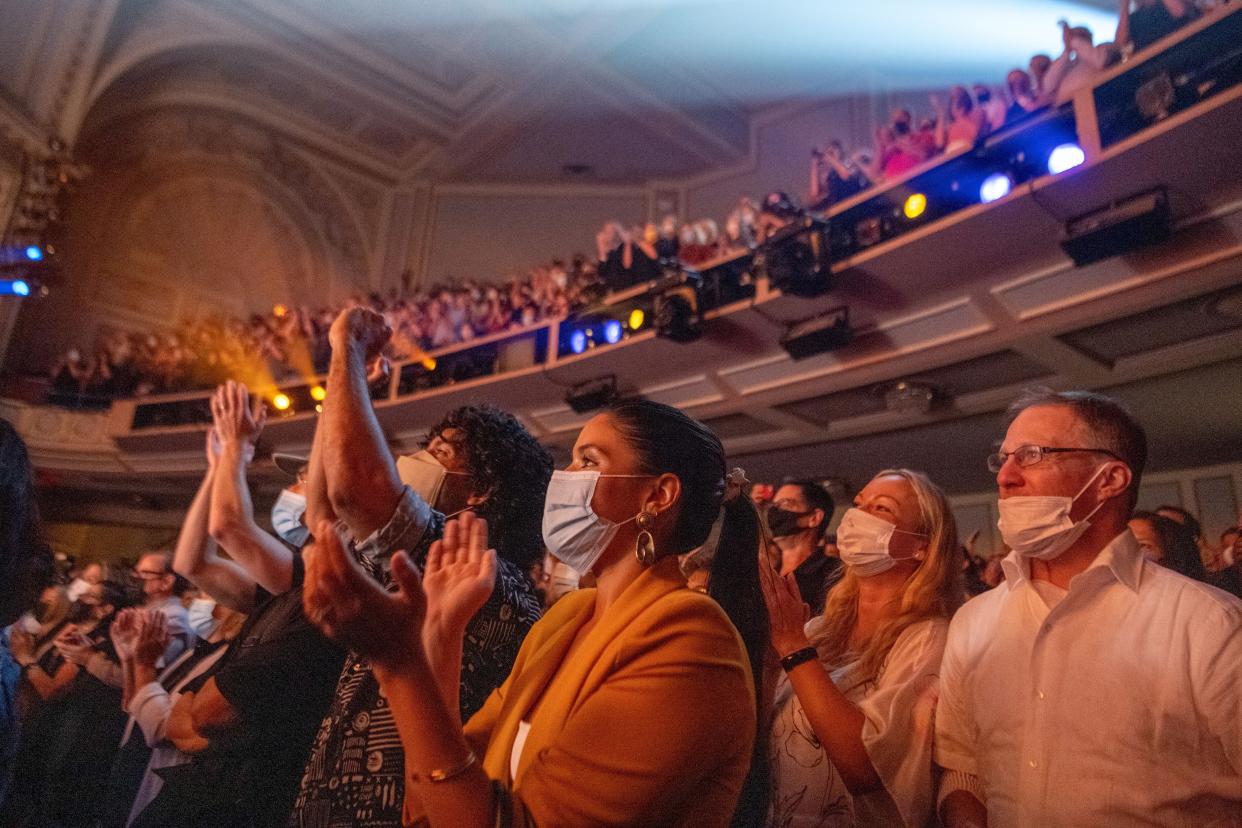 Audience members scream and applaud during "Chicago" at Ambassador Theatre on reopening night on Sept. 14, in New York City. 