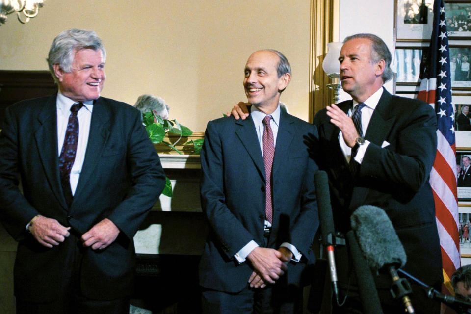 FILE - Sen. Joseph Biden, D-Del., chairman of the Senate Judiciary Committee, right, talks to President Clinton's Supreme Court nominee Stephen Breyer, center, and Sen. Edward Kennedy, D-Mass., looks on, on Capitol in Washington, May 17, 1994. Kennedy escorted Breyer on Capitol Hill to meet Senators including Biden whose committee will hold Breyer's nomination hearings. (AP Photo/John Duricka, File)