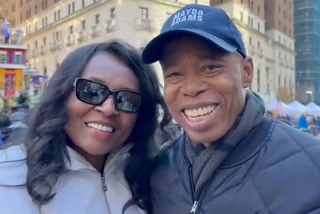 <p>Eric Adams X</p> Eric Adams and Tracey Collins at the 2023 Macy's Thanksgiving Parade in New York City.