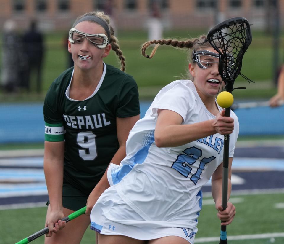Wayne, NJ - May 3, 2023 — Katie McGuire of DePaul knocks the ball from Alex Morgan of Wayne Valley as Wayne Valley topped DePaul in the Passaic County Girls Lacrosse Tournament 14-5.