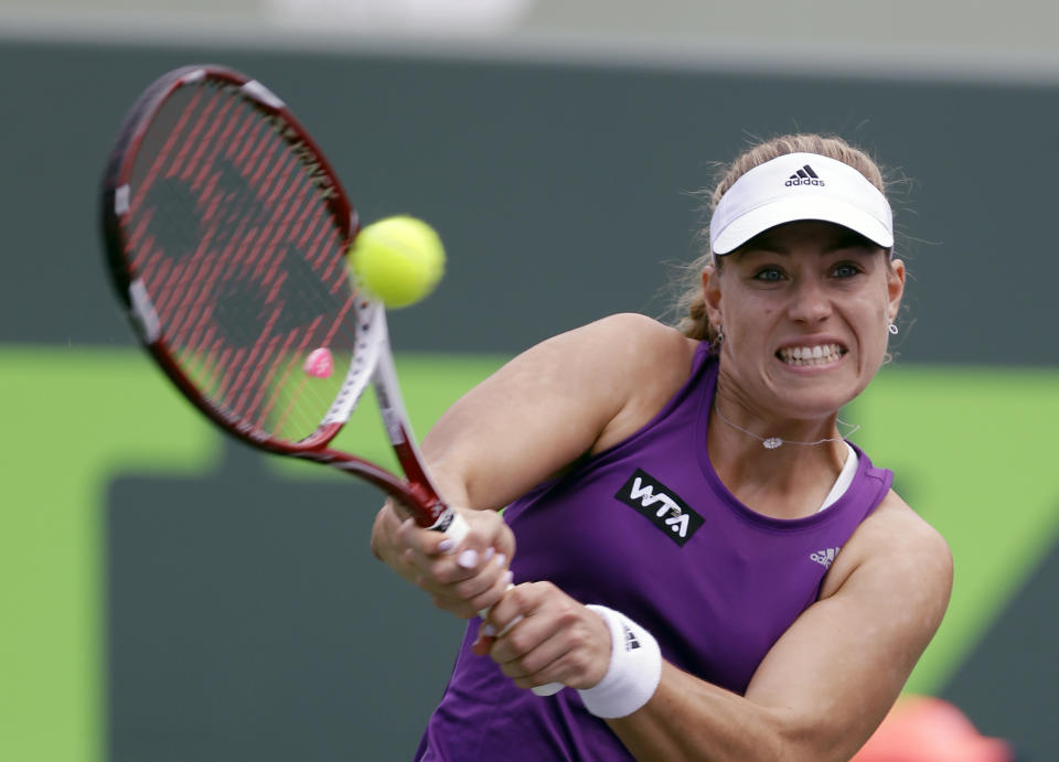 Angelique Kerber, of Germany, returns to Peng Shuai, of China, at the Sony Open tennis tournament in Key Biscayne, Fla., Thursday, March 20, 2014. (AP Photo/Alan Diaz)