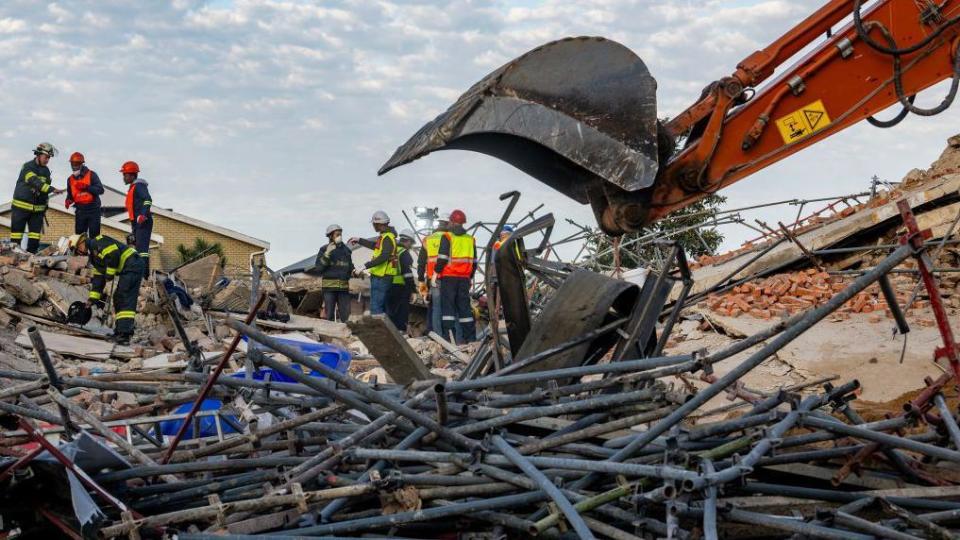     Rescue teams continue their search and rescue efforts at the Neo Victoria apartment building on Victoria Street on May 7, 2024 in George, South Africa