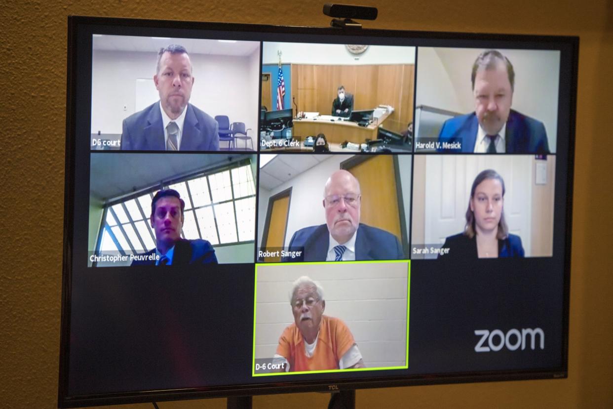 Defendants Paul Flores, top left, and his father Ruben Flores, bottom center, appear via video conference during their arraignment, Thursday, April 15, in San Luis Obispo Superior Court in San Luis Obispo, Calif. 