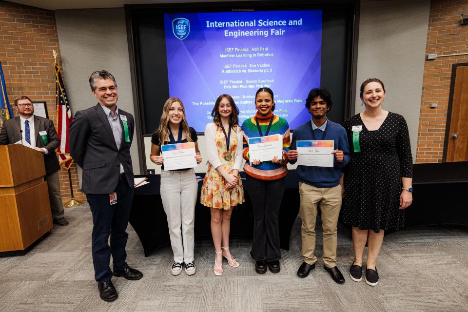 (left) Judges Dan Nielsen and Cherilyn Dossett flank (left to right) ISEF finalist Eve Vaclaw, ISEF first alternate Adrianna Van Eman, ISEF finalist Xenon Spurlock and ISEF finalist Adit Paul as they celebrate being selected to attend the International Science and Engineering Fair in Los Angeles.