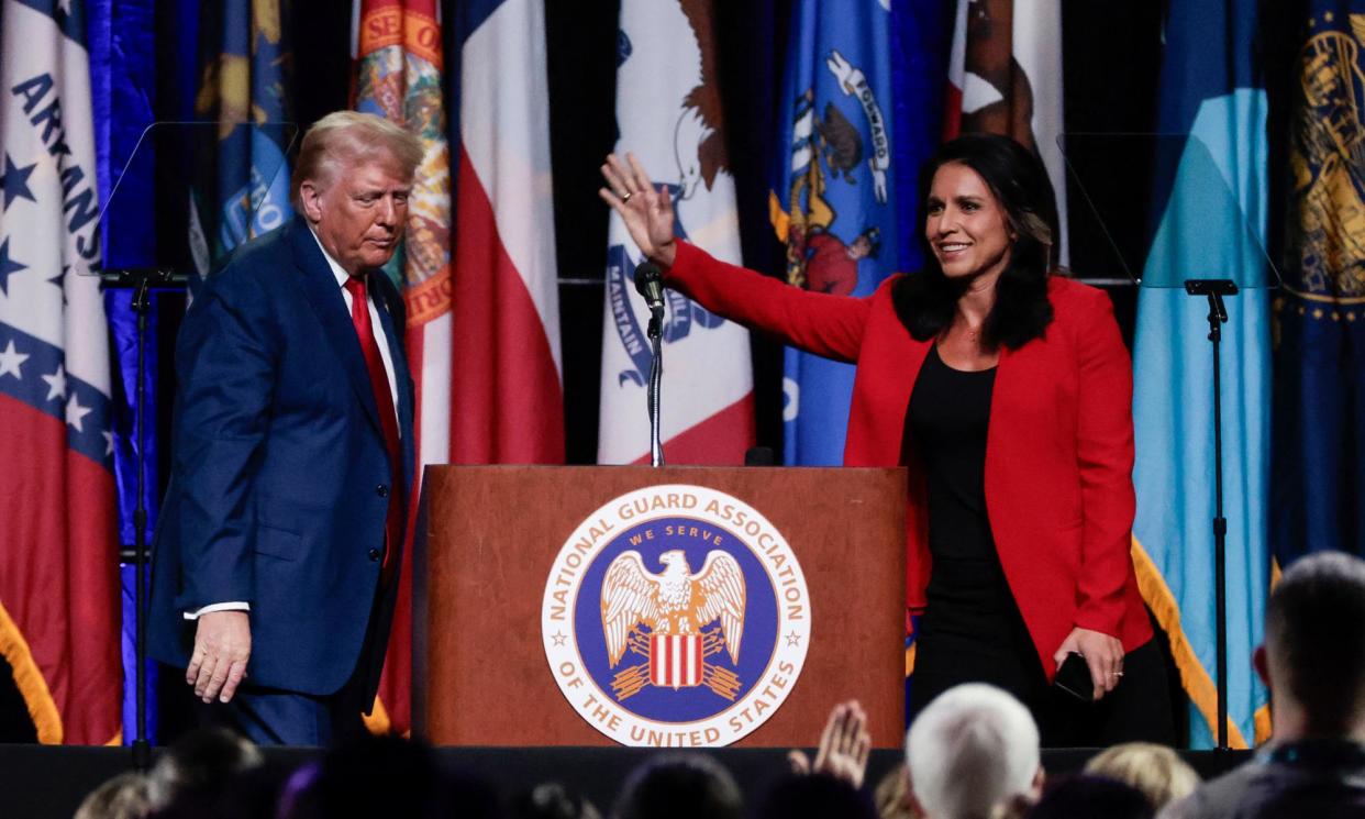 <span>Tulsi Gabbard waves after endorsing Donald Trump at the National Guard Association conference in Detroit, Michigan, on Monday.</span><span>Photograph: Jeff Kowalsky/AFP/Getty Images</span>