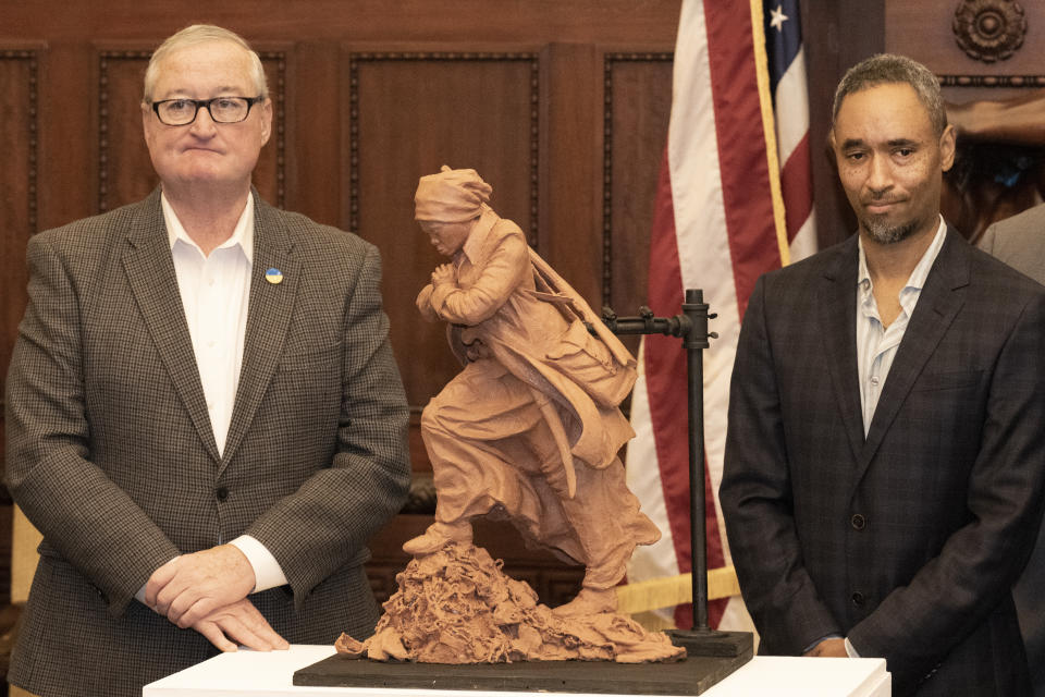 Mayor of Philadelphia Jim Kenney poses for a photo with Alvin Pettit, artist of the winning sculpture of Harriet Tubman that was unveiled on Monday, Oct. 30, 2023, at Philadelphia City Hall in Philadelphia. (Jose F. Moreno /The Philadelphia Inquirer via AP)