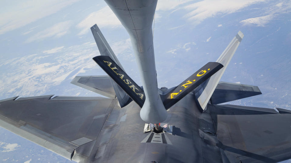 FILE - In this photo provided by the Alaska National Guard, an F-22 Raptor fighter jet hooks up to an Alaska Air National Guard KC-135 Stratotanker, from the 168th Air Refueling Wing, to conduct in-air refueling over the Joint Pacific Alaska Range Complex during their fighter/bomber exercises, May 1, 2014. The Air National Guard has delayed personnel changes in Alaska until Sept. 2025, that could have threatened national security and civilian rescue missions. (Lt. Bernie Kale/Alaska National Guard via AP)