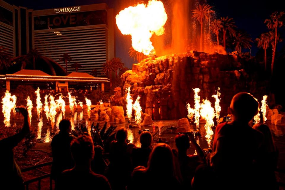 PHOTO: People watch the Volcano show at the Mirage hotel-casino along the Las Vegas Strip, May 13, 2022, in Las Vegas.  (John Locher/AP, FILE)