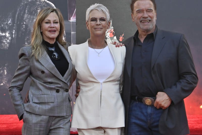 Jamie Lee Curtis (C) is joined by actors Melanie Griffith (L) and Arnold Schwarzenegger (R) during a hand and footprint ceremony immortalizing her in the forecourt of the TCL Chinese Theatre (formerly Grauman's) in Hollywood in 2022. File Photo by Jim Ruymen/UPI