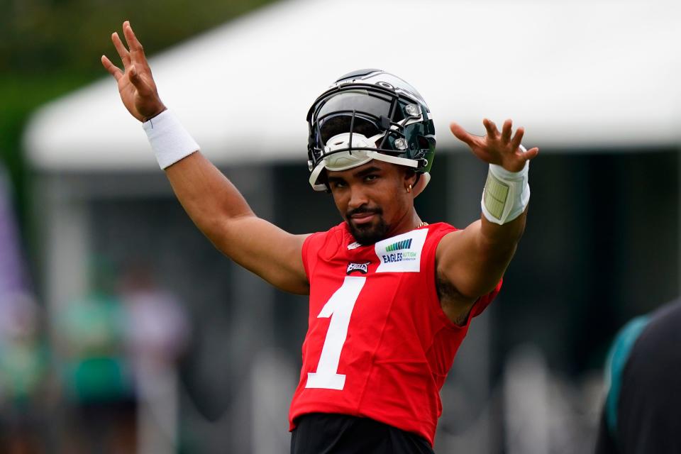 Philadelphia Eagles' Jalen Hurts reacts to cheering fans during training camp at the NFL football team's practice facility, Friday, July 29, 2022, in Philadelphia. (AP Photo/Matt Slocum)
