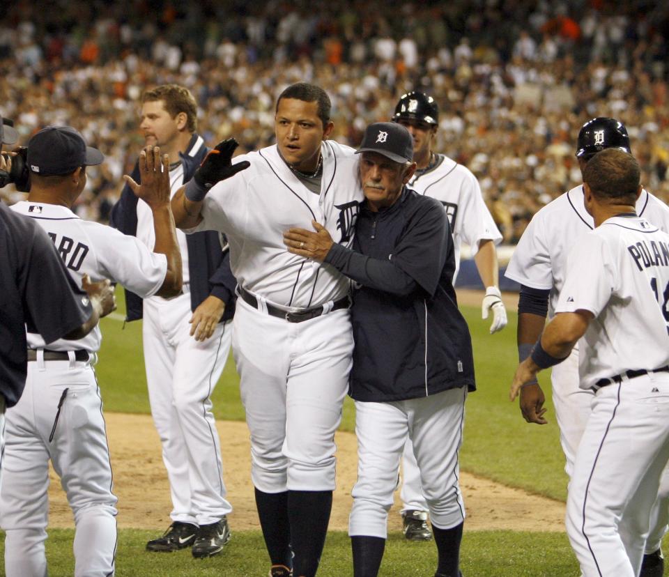 Former Detroit Tigers manager Jim Leyland hugs Miguel Cabrera as they walk off the field after celebrating Cabrera's 2 run walk off home Run to beat  the Cleveland Indians 8-6 in the  bottom of the 9th inning at Comerica Park in Detroit on Wednesday July 9, 2008,