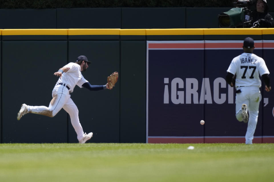 Detroit Tigers center fielder Matt Vierling, left, and right fielder Andy Ibanez (77) chase the two-run double hit by Pittsburgh Pirates' Austin Hedges during the second inning of a baseball game, Wednesday, May 17, 2023, in Detroit. (AP Photo/Carlos Osorio)