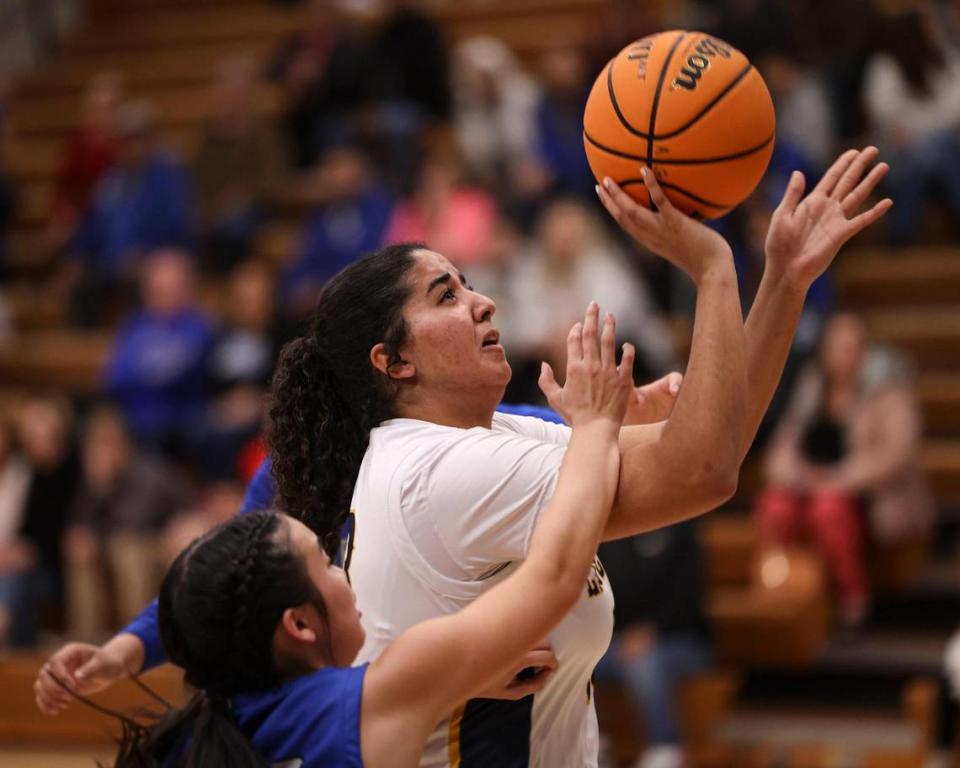 Kinzie Amer takes a shot. Caruthers High School won over Arroyo Grande 51-36 in a girl’s basketball playoff Feb. 14, 2024. David Middlecamp/dmiddlecamp@thetribunenews.com
