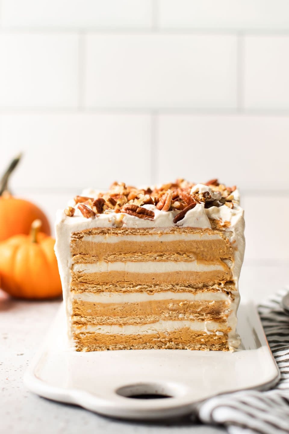 <p>This heavenly pumpkin cake has layers of pumpkin cheesecake and marshmallow cream, but the best part is that it doesn’t even require turning on the oven.</p><p><strong>Get the recipe at <a href="https://everydaypie.com/pumpkin-icebox-cake/" rel="nofollow noopener" target="_blank" data-ylk="slk:Everyday Pie;elm:context_link;itc:0;sec:content-canvas" class="link ">Everyday Pie</a>.</strong></p>