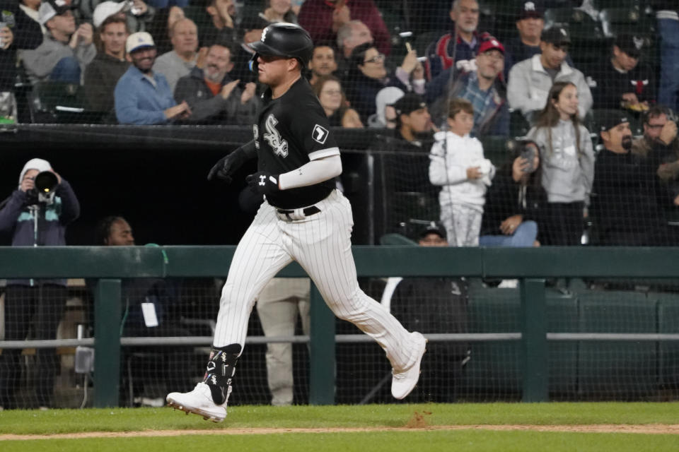Chicago White Sox's Gavin Sheets (32) runs the bases after hitting a home run against the Cleveland Guardians during the eighth inning of a baseball game Thursday, Sept. 22, 2022, in Chicago. (AP Photo/David Banks)