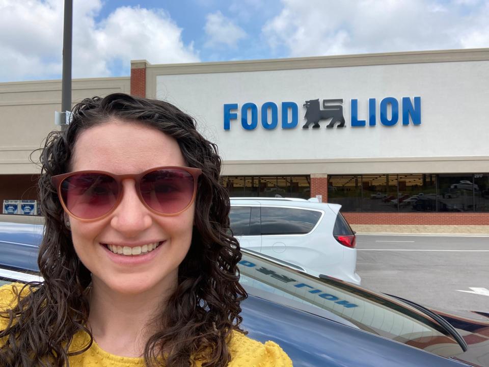 Insider reporter Talia Lakritz takes a selfie in the parking lot of a Food Lion grocery store.