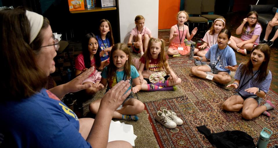 Music teacher Kathleen Foulkrod leads students through an echo singing exercise before they sing and rehearse "Freak Flag" in the Summer Theatre Arts Camp at River Raisin Centre for the Arts in Monroe.