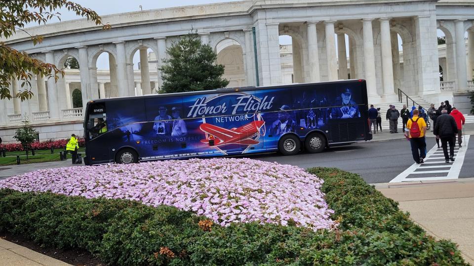 The Honor Flight bus is parked at the entrance of Arlington National Cemetery on Oct. 1.