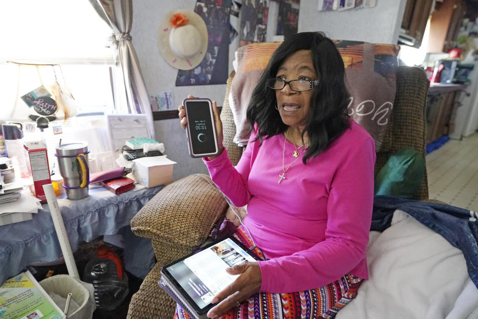 Mary Christian, 71, of McComb, Miss., recalls Friday, Jan. 15, 2021, the hours she spent on both her cell phone and iPad trying to arrange an appointment online for a COVID-19 vaccination through the Mississippi State Department of Health website and on their listed registration phone line. Eventually, with help from one of her sons, she was able to enter the registration site only to find vaccination locations with openings were at least an hour's drive from the county she lives in and upon trying to sign up was informed they had no more openings. (AP Photo/Rogelio V. Solis)