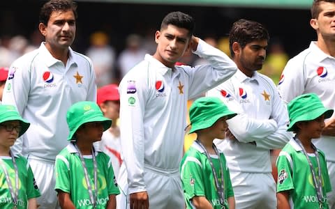 Pakistan's Naseem Shah, center, lines up with his team during the cricket test match between Australia and Pakistan in Brisbane - Credit: AP Photo/Tertius Pickard