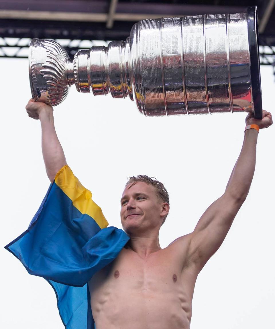 Florida Panthers defenseman Gustav Forsling (42) lifts the Stanley Cup during a victory parade rally at the Fort Lauderdale Beach Park off A1A on Sunday, June 30, 2024, in Fort Lauderdale, Fla. The parade was held to celebrate the Florida Panthers after they defeated the Edmonton Oilers in Game 7 of the Stanley Cup Final.