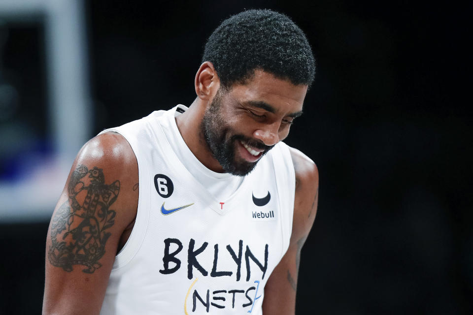 Brooklyn Nets guard Kyrie Irving reacts after scoring against the Memphis Grizzlies during the second half of an NBA basketball game Sunday, Nov. 20, 2022, in New York. (AP Photo/Eduardo Munoz Alvarez)