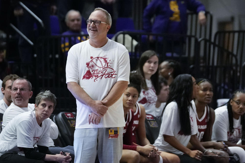 Arkansas head coach Mike Neighbors responds to a call by an official in the second half an NCAA college basketball game against LSU in Baton Rouge, La., Thursday, Jan. 19, 2023. LSU won 79-76. (AP Photo/Gerald Herbert)