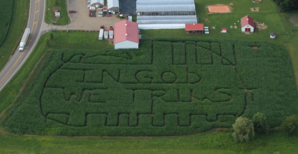 McDonald's Greenhouse and Corn Maze for 2023 is a flag with the motto "In God We Trust."