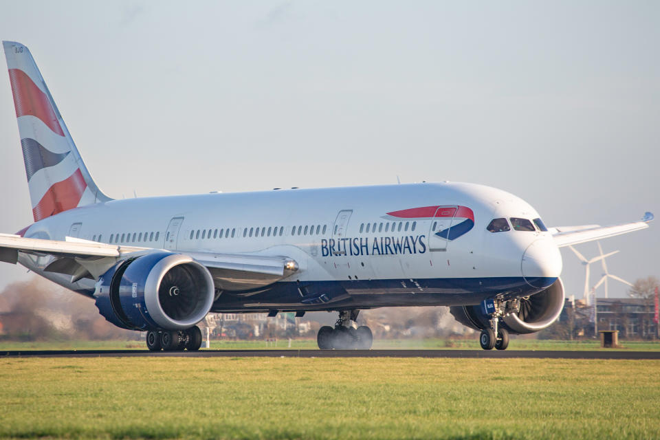 British Airways Boeing 787-8 Dreamliner passenger aircraft as seen on final approach flying, touching down, landing and taxiing in Amsterdam Schiphol AMS EHAM International airport in the Netherlands at Polderbaan runway. The wide-body modern and advanced airplane of BA has the registration G-ZBJG and is powered by 2x RR Rolls Royce jet engines. British Airways is the flag carrier of the United Kingdom UK connecting London Heathrow in England to the Dutch city Amsterdam. BAW Speedbird is owned by IAG International Airlines Group and is member of Oneworld aviation alliance. The world passenger traffic declined during the coronavirus covid-19 pandemic era with the industry struggling to survive. Amsterdam, Netherlands on November 18, 2020 (Photo by Nicolas Economou/NurPhoto via Getty Images)