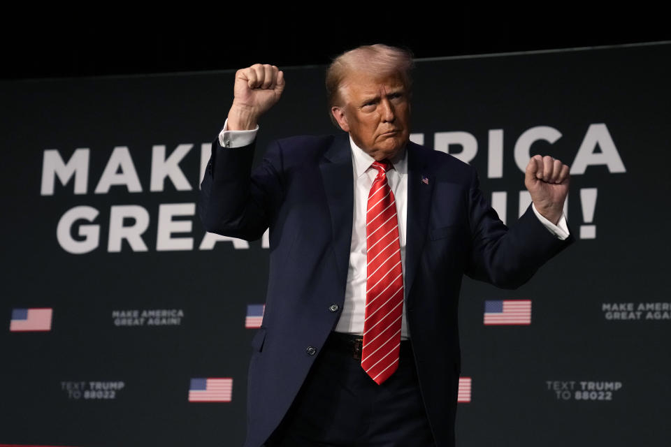 Former President Donald Trump dances on stage during a commit to caucus rally, Sunday, Oct. 29, 2023, in Sioux City, Iowa. (AP Photo/Charlie Neibergall)