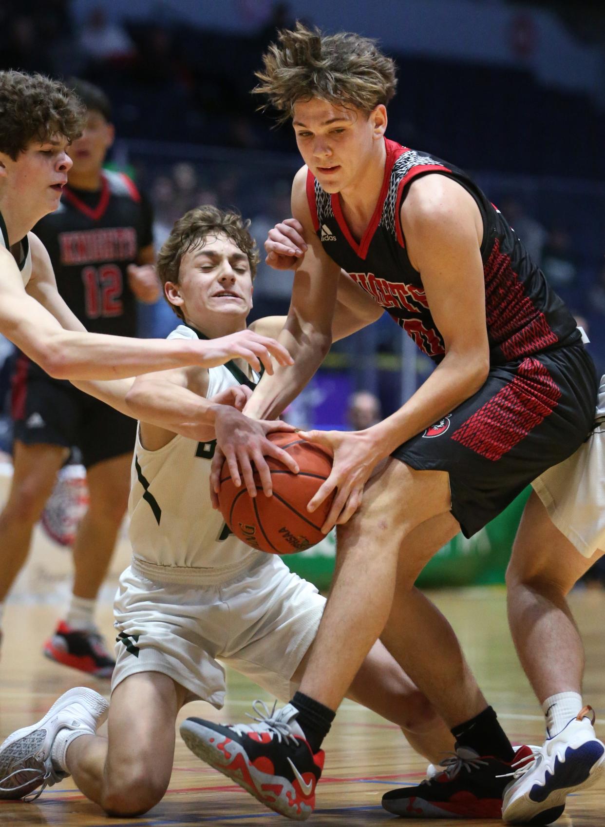 Northstar Christian's Lorenzo Danesi gets tied up with Avon's Josh Harter as they battle for the ball.