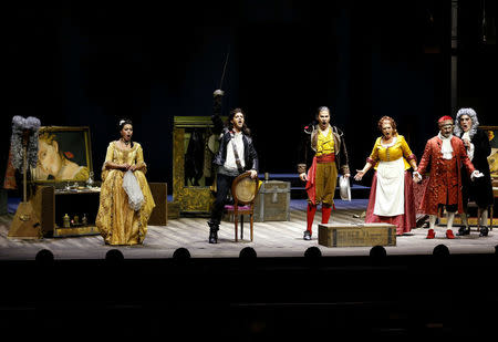 Performers take part in a dress rehearsal for the Barber of Seville ahead of the opening of the first Dubai Opera house, the UAE August 30, 2016. REUTERS/Ahmed Jadallah