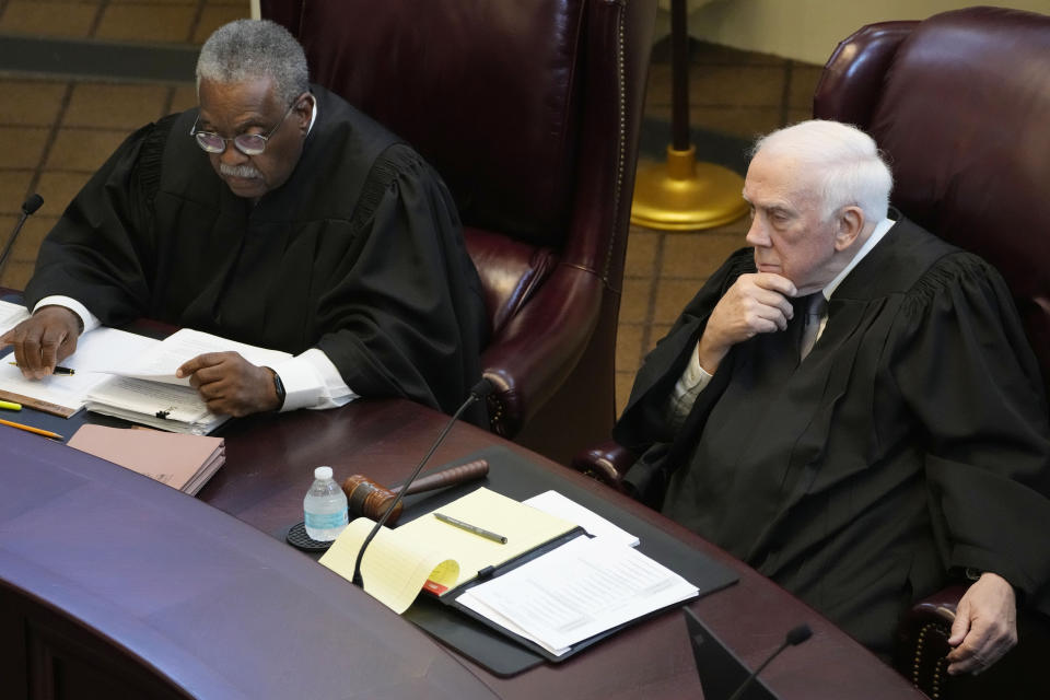 Mississippi Supreme Court Presiding Justices Leslie D. King, left, and James W. Kitchens, listen as lawyers argue over the constitutionality of a Mississippi law that would authorize some judges who would be appointed in a state where most judges are elected, Thursday, July 6, 2023, before the state supreme court in Jackson, Miss. (AP Photo/Rogelio V. Solis)