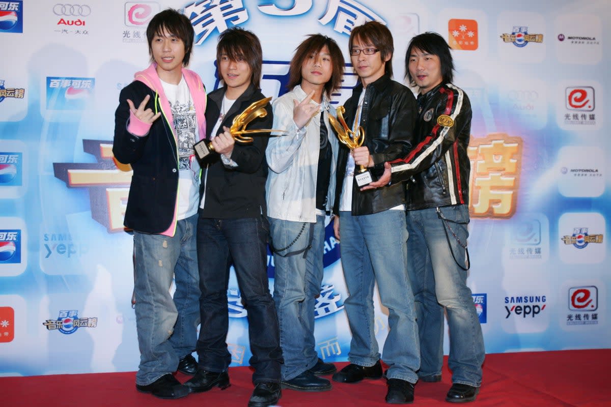 Members of Taiwan singing group ‘Mayday’ pose for pictures at 5th Pepsi Music Chart Awards ceremony on 20 March 2005 in Beijing, China (Getty Images)