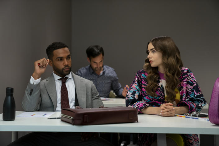 Emily in Paris. (L to R) Lucien Laviscount as Alfie, Lily Collins as Emily in episode 204 of Emily in Paris. (Stephanie Branchu/Netflix)