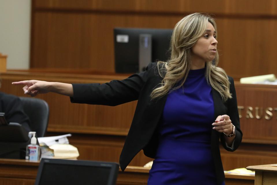 Constance Patterson, Monroe County Assistant District Attorney, points at the defendant James Krauseneck Jr., as she gives the prosecution's opening statement in the murder trial of Krauseneck at the Hall of Justice in Rochester Tuesday, Sept. 6, 2022.