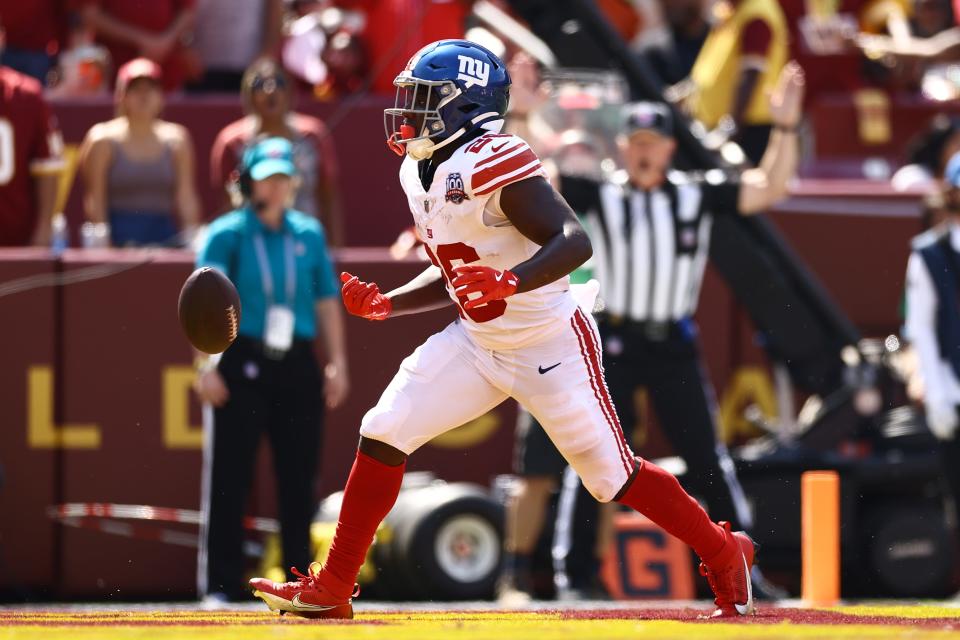 LANDOVER, MARYLAND - SEPTEMBER 15: Devin Singletary #26 of the New York Giants scores a first quarter touchdown against the Washington Commanders at Northwest Stadium on September 15, 2024 in Landover, Maryland. (Photo by Tim Nwachukwu/Getty Images)