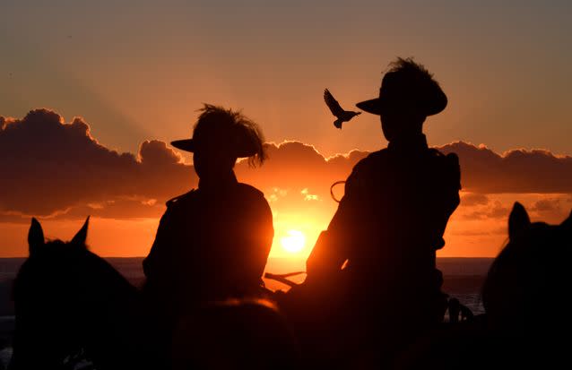 Horesmen remained mounted throughout the ceremony at Currumbin. Source: AAP