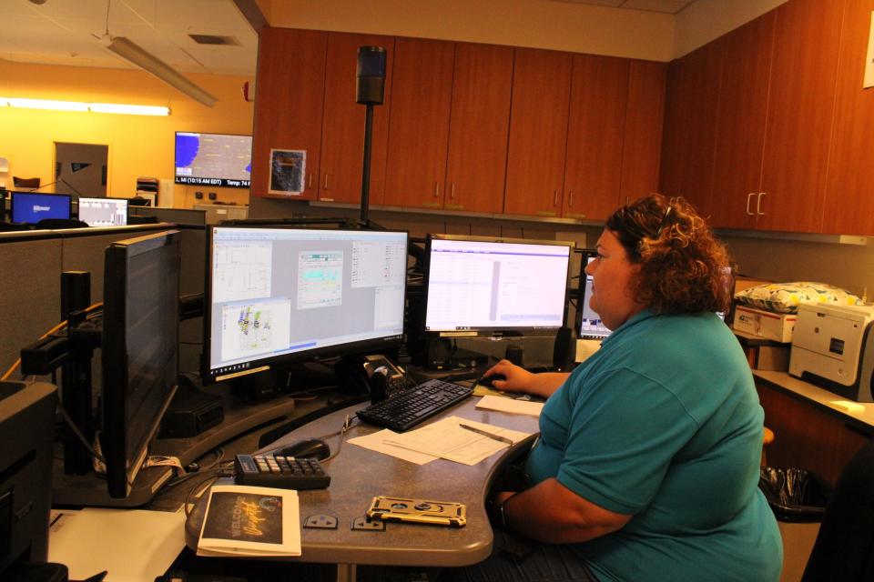 Erin Allwardt fields calls inside the Calhoun County Consolidated Dispatch Center Friday, June 17, 2022 in Marshall, Mich.