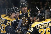 Boston Bruins' Nick Ritchie (21) celebrates his goal with Charlie McAvoy (73), Zdeno Chara (33), Par Lindholm (26) and Chris Wagner during the second period of an NHL hockey game against the Dallas Stars in Boston, Thursday, Feb. 27, 2020. (AP Photo/Michael Dwyer)