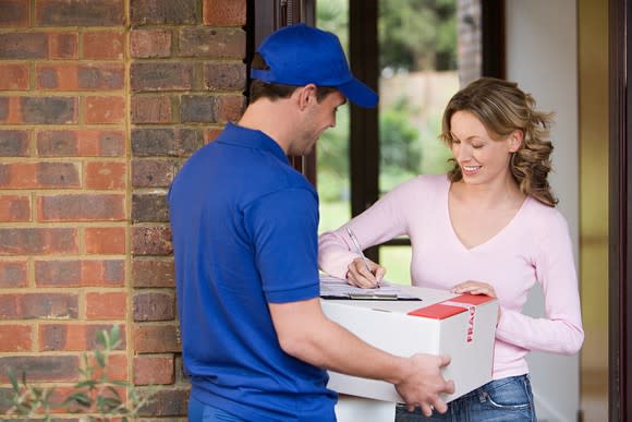 A customer signs for a package.