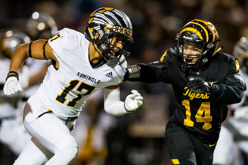 Seminole's Hector Contreras tries to run past a Snyder defender in a bi-district game last season in Lubbock.