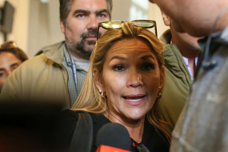 Bolivian opposition leader and senator Jeanine Anez Chavez speaks to the media as she leaves the Congress building in La Paz