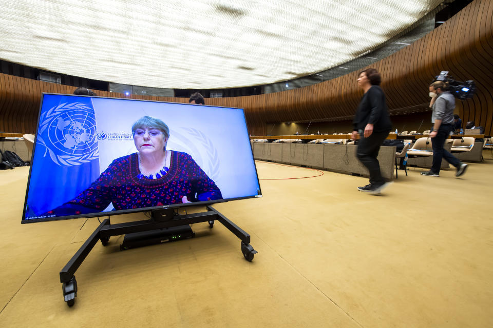 CORRECTING DATE TO 27 - UN High Commissioner for Human Rights Michelle Bachelet, is displayed on a screen as she delivers her speech during a special session of the UN Human Rights Council to discuss situation in the Occupied Palestinian Territory, at the European headquarters of the United Nations in Geneva, Switzerland, Thursday, May 27, 2021. (Martial Trezzini/Keystone via AP)